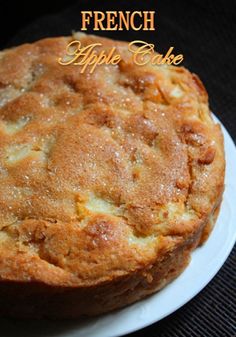 a close up of a cake on a plate with the words french apple cake above it