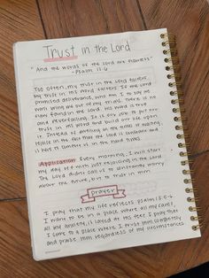 a notepad with writing on it that says trust in the lord