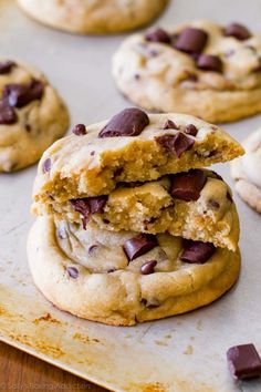 chocolate chip cookies are stacked on top of each other