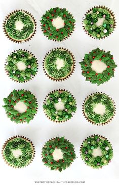 twelve cupcakes decorated with green and red decorations