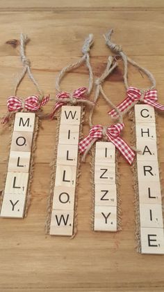 wooden scrabbles with bows tied around them spelling the word mollify