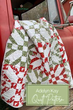 an old red truck with a quilt on the front and side of it that says, adelinn kay quilt patterns