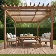 an outdoor patio with wooden furniture and white cushions on the deck, surrounded by greenery