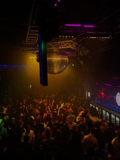 a large group of people in a dark room