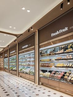 the inside of a grocery store filled with lots of fresh food and drinks on display