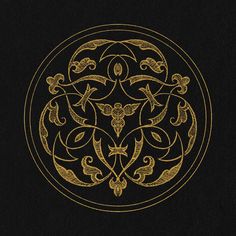 an ornate design in gold on a black background