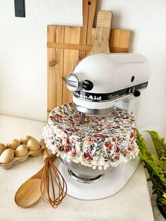 a stand mixer sitting on top of a counter