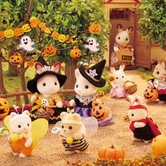 a group of mice dressed up in halloween costumes with pumpkins and jack - o'- lanterns