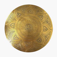 a gold plate with intricate designs on it