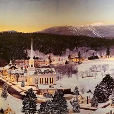 a painting of a town in the middle of winter with snow on the ground and mountains behind it