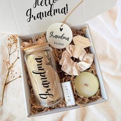 an open box containing candles, soaps and other personalized items for someone's special occasion