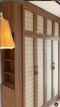 a large wooden cabinet with glass doors and shelves