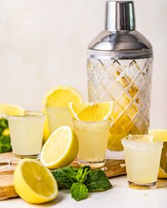 lemonade and mint cocktails are arranged on a table