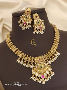 Description :- Indian Jewelry South Indian Wedding Necklace Bridal Jewellery, Handmade Gold Plated Traditional Kemp Necklace Set Gold-Plated Indian Jewelry Set with Long Necklace and Earrings, Wedding Braidmaid Set, Bridal Set, Bead Set The biggest highlight of this manalis necklace set lies in its detailing. The designers at Tarinika have put meticulous attention to details in order to perfect the detailing of the unique and intricate design. The bead-like design of the necklace's chain fuses e Indian Wedding Necklace, Kemp Necklace, Indian Jewelry Sets, Necklace Bridal, Gold Necklace Set, South Indian Wedding, Bead Set, Jewellery Handmade, Wedding Jewellery Necklace