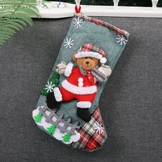 a christmas stocking with a teddy bear on it