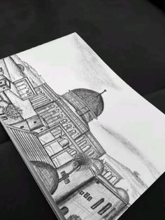 a pencil drawing of a building on paper