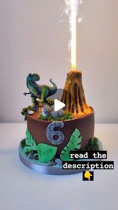 a cake with an image of dinosaurs on it and the words read the description below