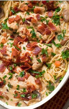 a white bowl filled with pasta and meat