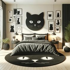 a bedroom with black and white cat decorations on the wall, bedding and pillows