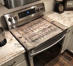 a stove top oven sitting inside of a kitchen next to a microwave and countertop