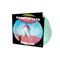 harry styles fine line album on a black vinyl record with an image of a man in white pants