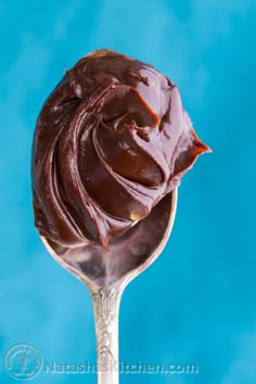 a spoon with chocolate frosting on it