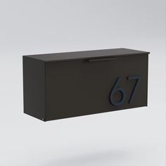 a black mailbox with the number seventy on it's front and side panels