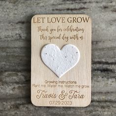 a wooden magnet with a heart on it that says, let love grow thank you for celebrating this special day with us