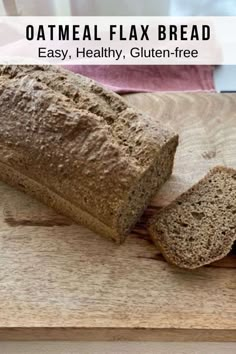 a loaf of oatmeal flax bread sitting on top of a cutting board