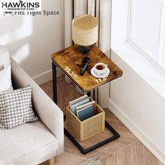 a small table with a cup of coffee on it next to a chair and lamp