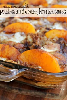 baked peaches and cream french toast casserole in a glass dish with a serving spoon