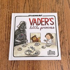 a children's book about vader's little princess on a wooden table