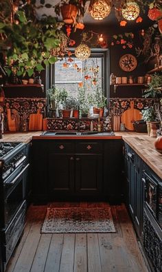 a kitchen filled with lots of pots and pans on the stove top next to an oven