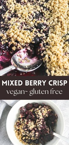 mixed berry crisp in a white bowl with spoons and blueberries on the side