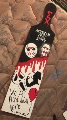 a skateboard that has been decorated to look like it is dripping blood and the words, we all float down here