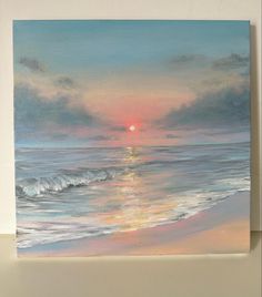 a painting of the sun setting over the ocean