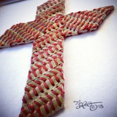 a red and white striped tie laying on top of a table