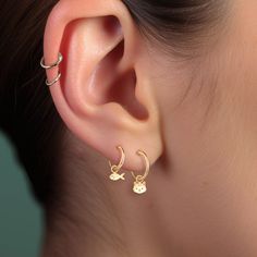 Dive into whimsy with our Whimsical Mismatched Cat & Fish Charm Hoop Earrings, a playful and unique addition to your jewelry collection. These enchanting earrings feature a charming cat on one hoop and a delightful fish on the other, creating a fun and eye-catching look. ✨ Handmade with Love: Each pair of our Huggie Hoop Earrings are meticulously crafted by hand with attention to detail and a passion for creating beautiful, high-quality jewelry. * We use the Highest Quality materials from the US Cat Hoop Earrings, Piercing Inspo, Ear Piercing, Cat Earrings, Huggie Hoop Earrings, Gold Hoops, Catfish, Jewelry Earrings Hoops, High Quality Jewelry