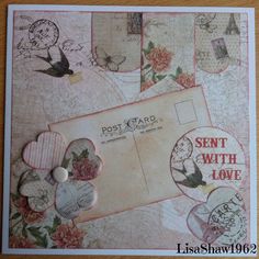 an old postcard has been decorated with flowers and birds on it's envelope