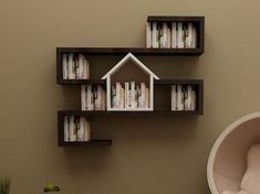 a book shelf with books and a house shaped like a house on top of it