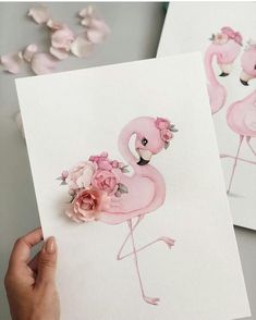 two pink flamingos with flowers in their beaks are shown on the instagram page