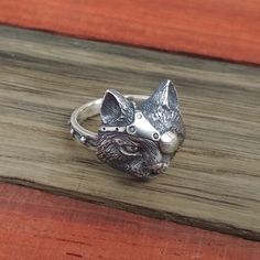 Steampunk Cat Head Ring Ring fits on finger with circumferences from 5 to 13 size (US).Head Width: 0.55 in. or 14 mm. Material: • Silver 925. Symbolic Cat Meanings • Astute• Clever• Selective• Secretive• Mysterious• Intuitive• Intelligent• Independent• Supernatural• Watchfulness   Production time: 2 weeksDelivery: 2-3 weeksHandmade takes time, we value your trust! ♥ Customer Service is our top priority. If you are unhappy with your purchase for any reason - please contact us. We will work our ha Silver Cat Ring, Ring Cat, Steampunk Cat, Steampunk Watch, Head Ring, Cat Ring, Silver Cat, Cat Jewelry, Handcrafted Earrings