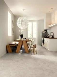 a dining room table and chairs in a kitchen