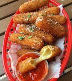 some fried food is on a red basket