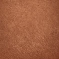 a brown leather texture background or textured upholstered with some sort of stitching