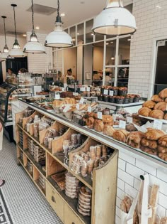 a bakery filled with lots of bread and pastries