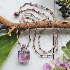 "https://www.etsy.com/shop/MYGEMSROCK Length: Beaded Necklace Length: 30\" L. Perfume Bottle Pendant: 0.65\" W x 1.65\" L approx. Gemstone/Crystal/Thread/base metal. Bead toggle clasp This necklace can be used as a simple gemstone pendant/ornament necklace. Or add perfume or essential oil to it. Fragrance will emit from the gap in the mouth of the bottle. The package comes with a plastic essential oil dropper. The bottle can contain approx 4-6 drops of perfume or essential oil. Each gemstone bot Ornament Necklace, Angel Aura Quartz Necklaces, Oil Dropper, Perfume Necklace, Eye Dropper, Essential Oil Necklaces, Vial Necklace, Mala Bead Necklace, Crystal Perfume Bottles