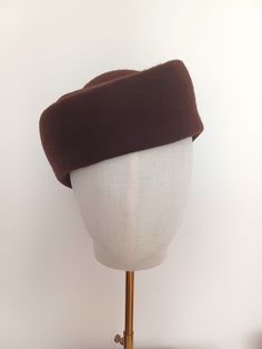 * Materials: This elegant  hat is made with high quality wool felt capeline in Dark Brown color. *Product info:  The felt capeline is stiffened with felt stiffener ( no smell ). It can be made in different sizes and colors. If you want to customize this item or you want another color that do not appear in the *variations box * contact with me . It will be my pleasure to create a custom headpiece for you. This headpiece is made with high quality materials , using traditional millinery tecniques. Retro Curved Brim Felt Hat For Winter, Fitted Wool Cloche Hat, Vintage Fall Felt Hat, Vintage Solid Felt Hat For Winter, Brown Wool Cloche Hat With Short Brim, Vintage Wool Felt Hat With Short Brim, Vintage Wool Cloche Hat For Fall, Brown Wool Cloche Hat For Winter, Brown Cloche Felt Hat For Winter