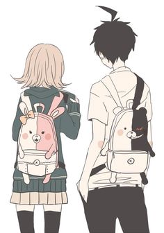 two people standing next to each other with backpacks on their backs and one holding a cat