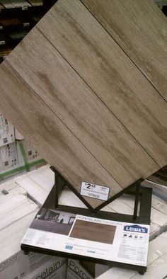 several different types of wood boards stacked on top of each other in a store display